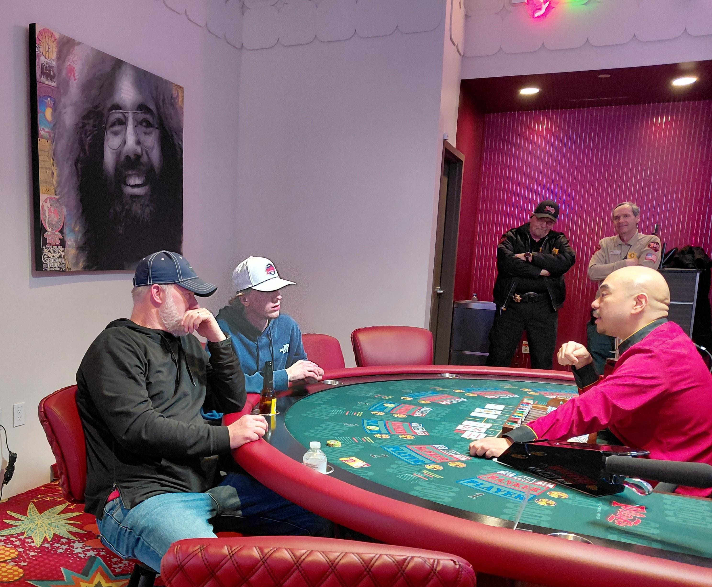 My husband and 21yr old son learning how to play Baccarat in the non-smoking area