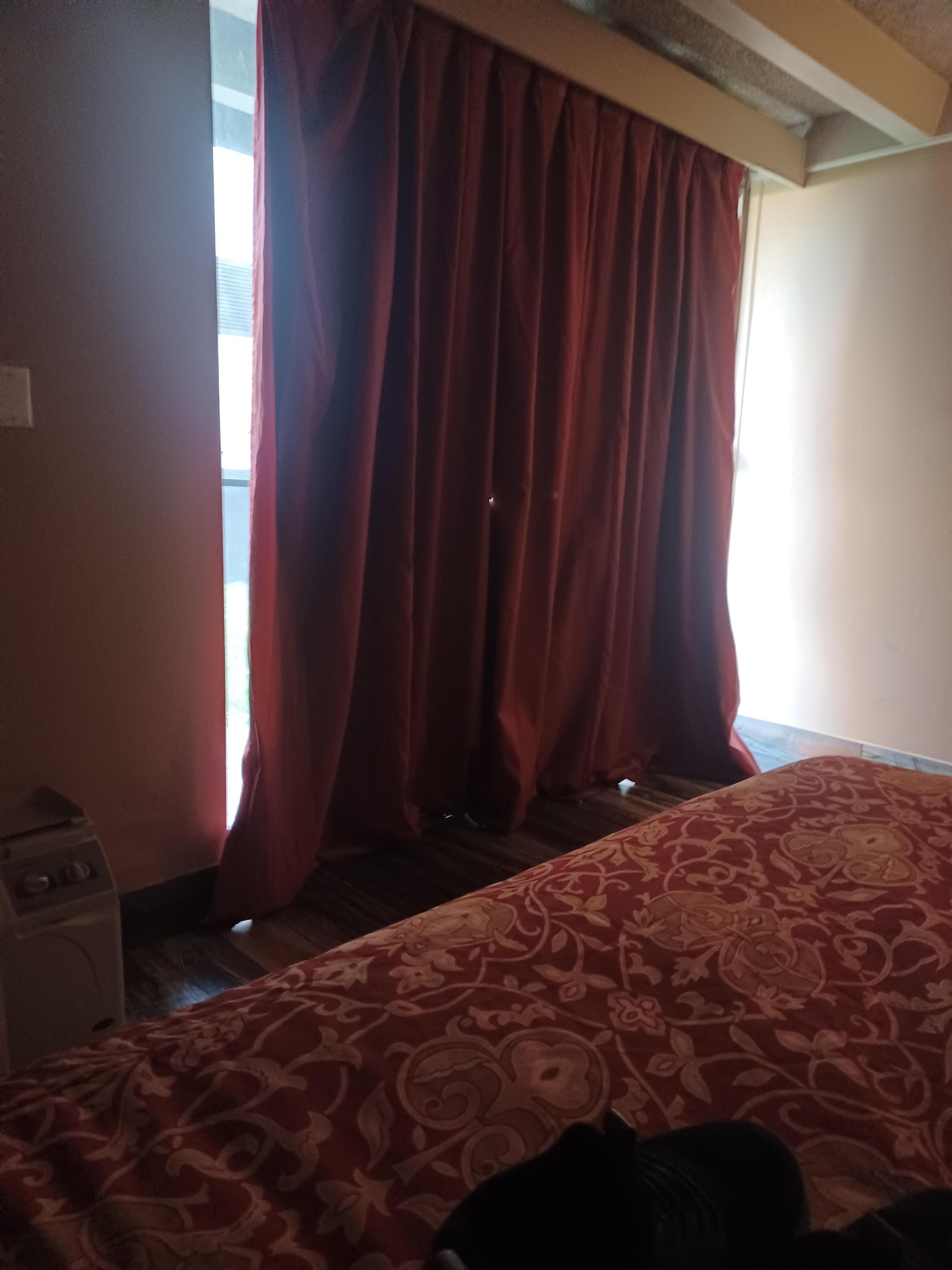 Sliding glassdoor/curtain with holes, tears, and wrinkles