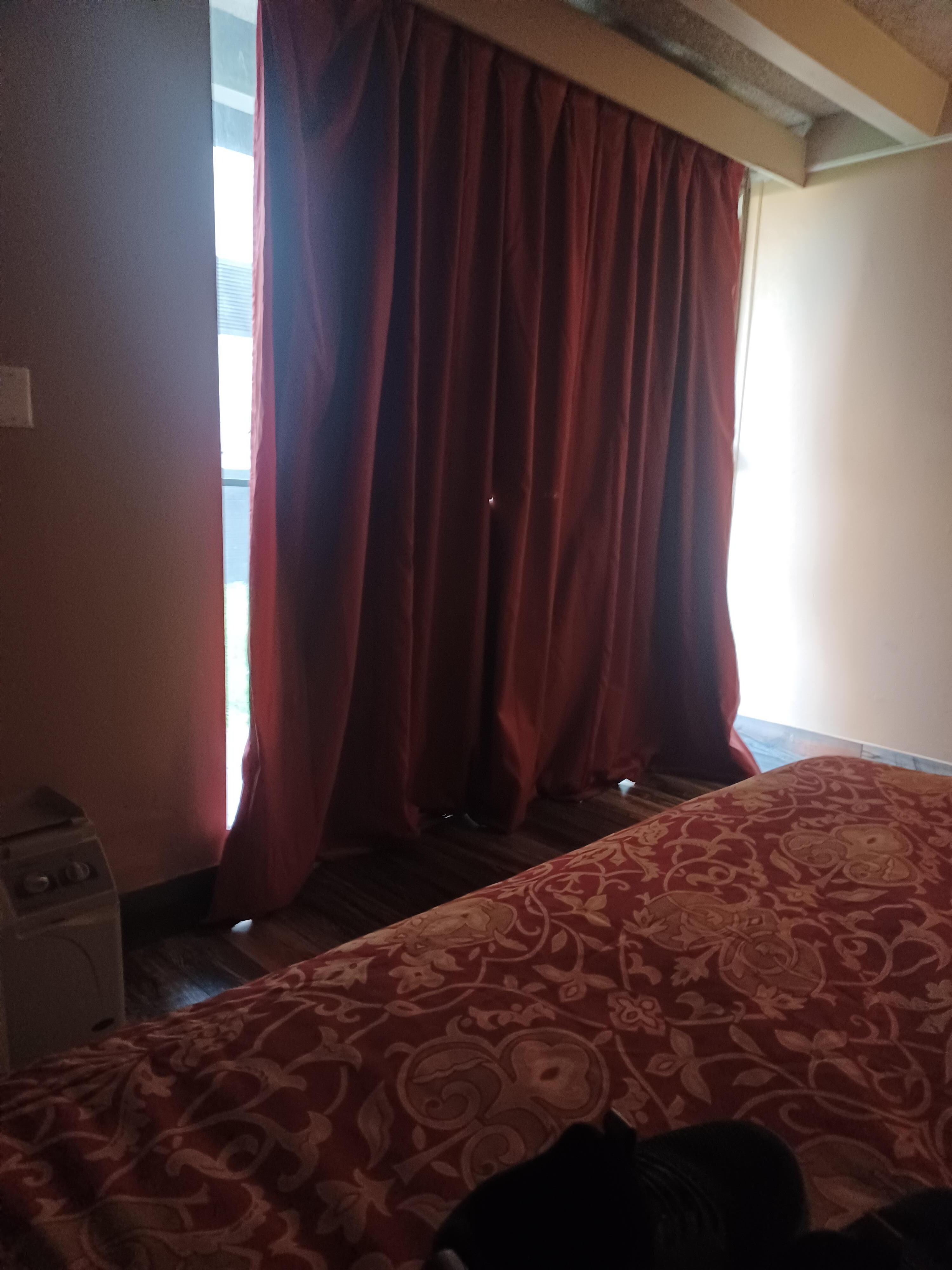 Sliding glassdoor/curtain with holes, tears, and wrinkles