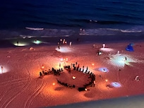 Nighttime bonfire for the softball team on the beach.