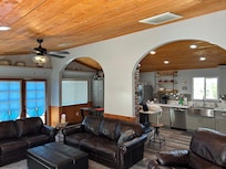 Roomy open concept with comfortable furniture.