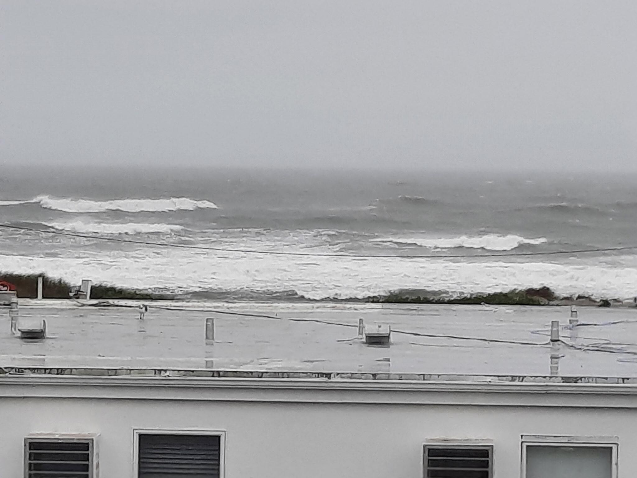 Off the end of the balcony.