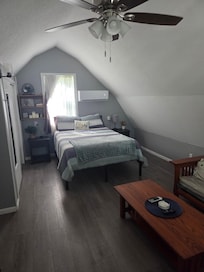 The bedroom is upstairs