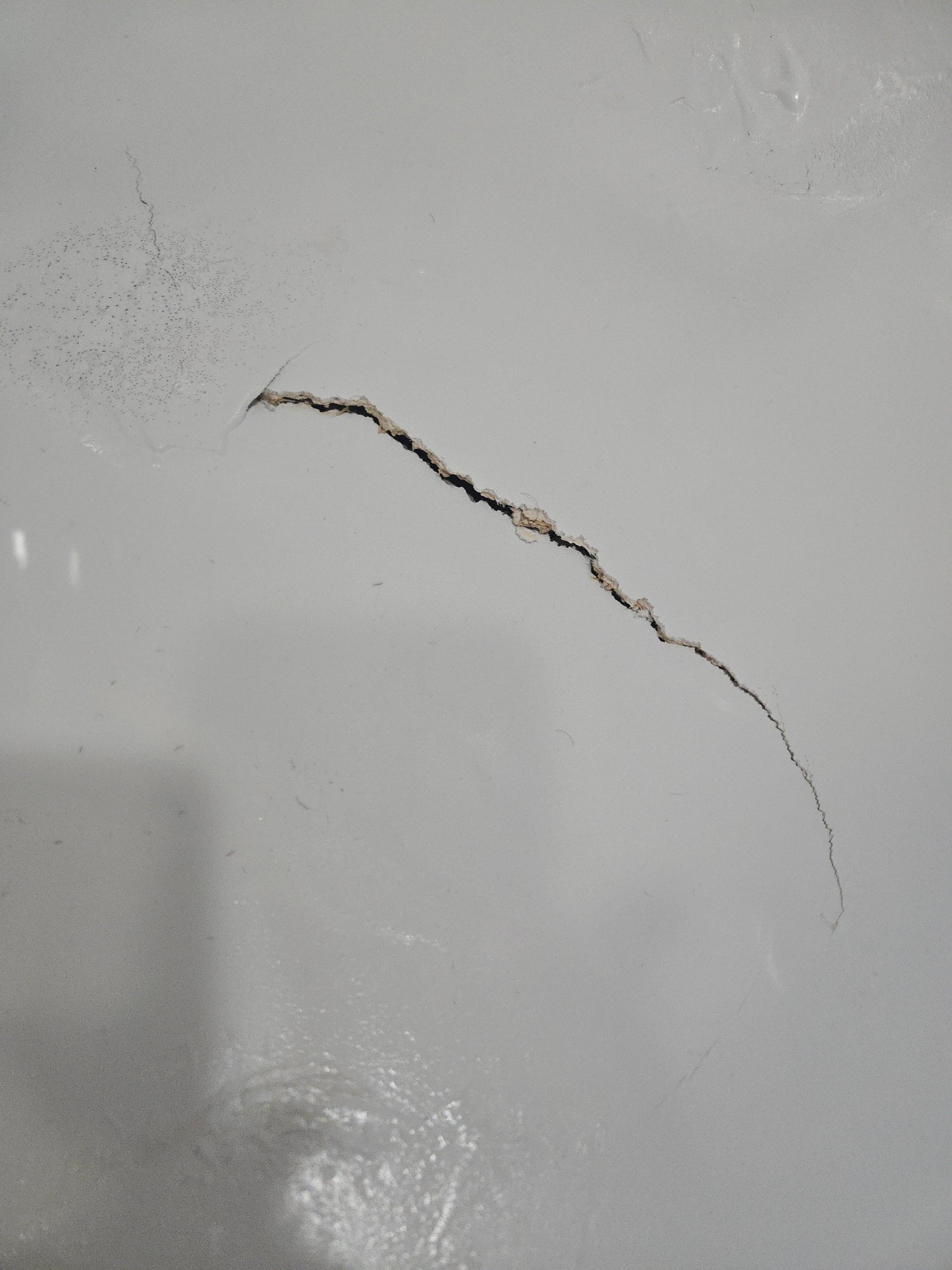 A close up of the hole in the bathtub