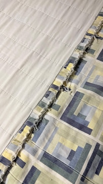 Manta que eu usei para me cobrir no quarto. Era o que tinha disponível.