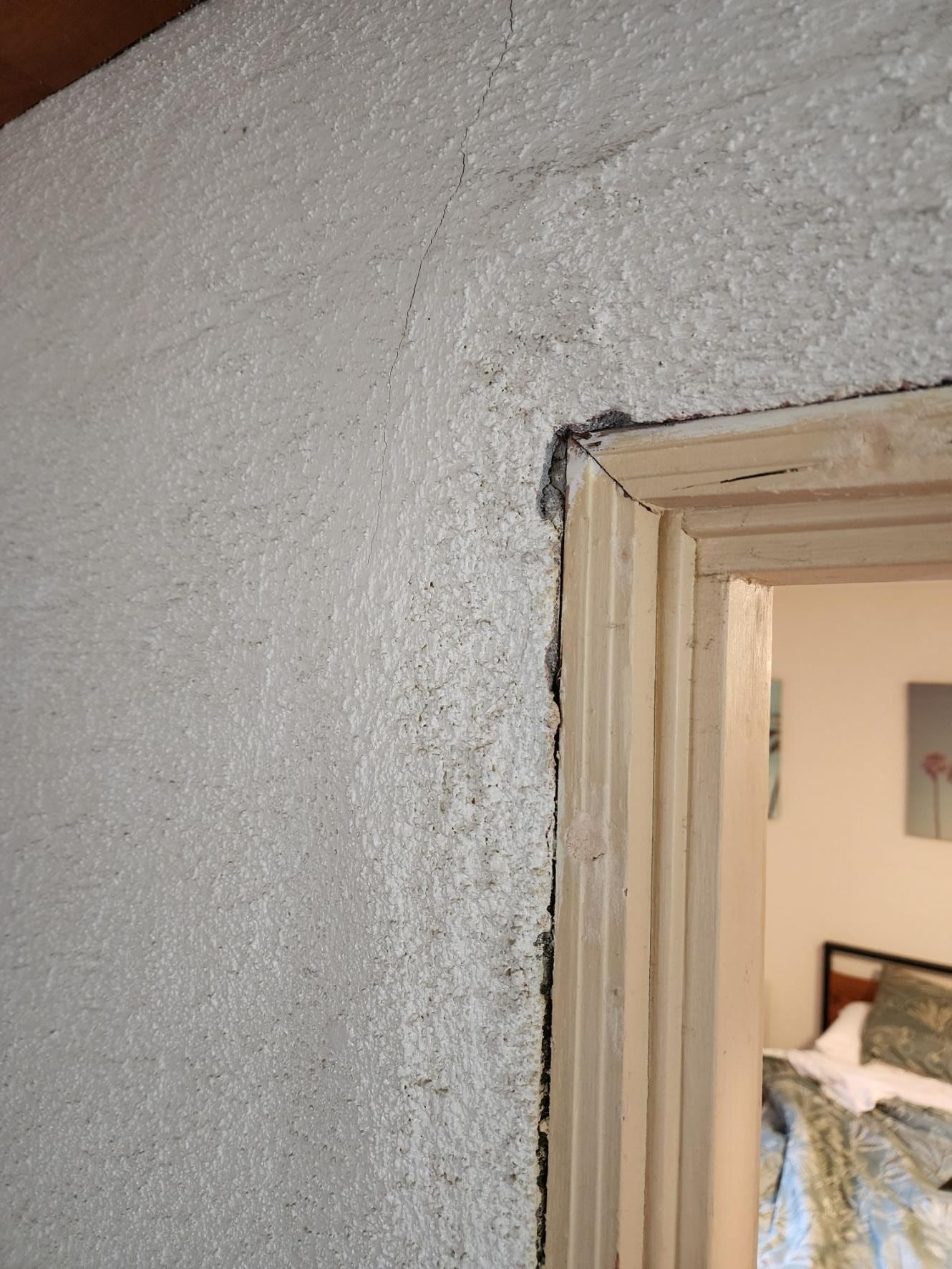 No door trim! This is a main doorway from the kitchen area to the bedroom / living area. It either is unfinished or finished with a horrible outcome.