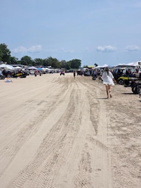 Friday by 9am. If we hadn't set up our tent and chairs at 7am, we wouldn't have had a spot on the beach in front of the house.