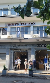 Front of hotel entrance. Boutique on ground floor, tattoo parlor on 2nd floor, elevator to upper floors for hotel accommodations.