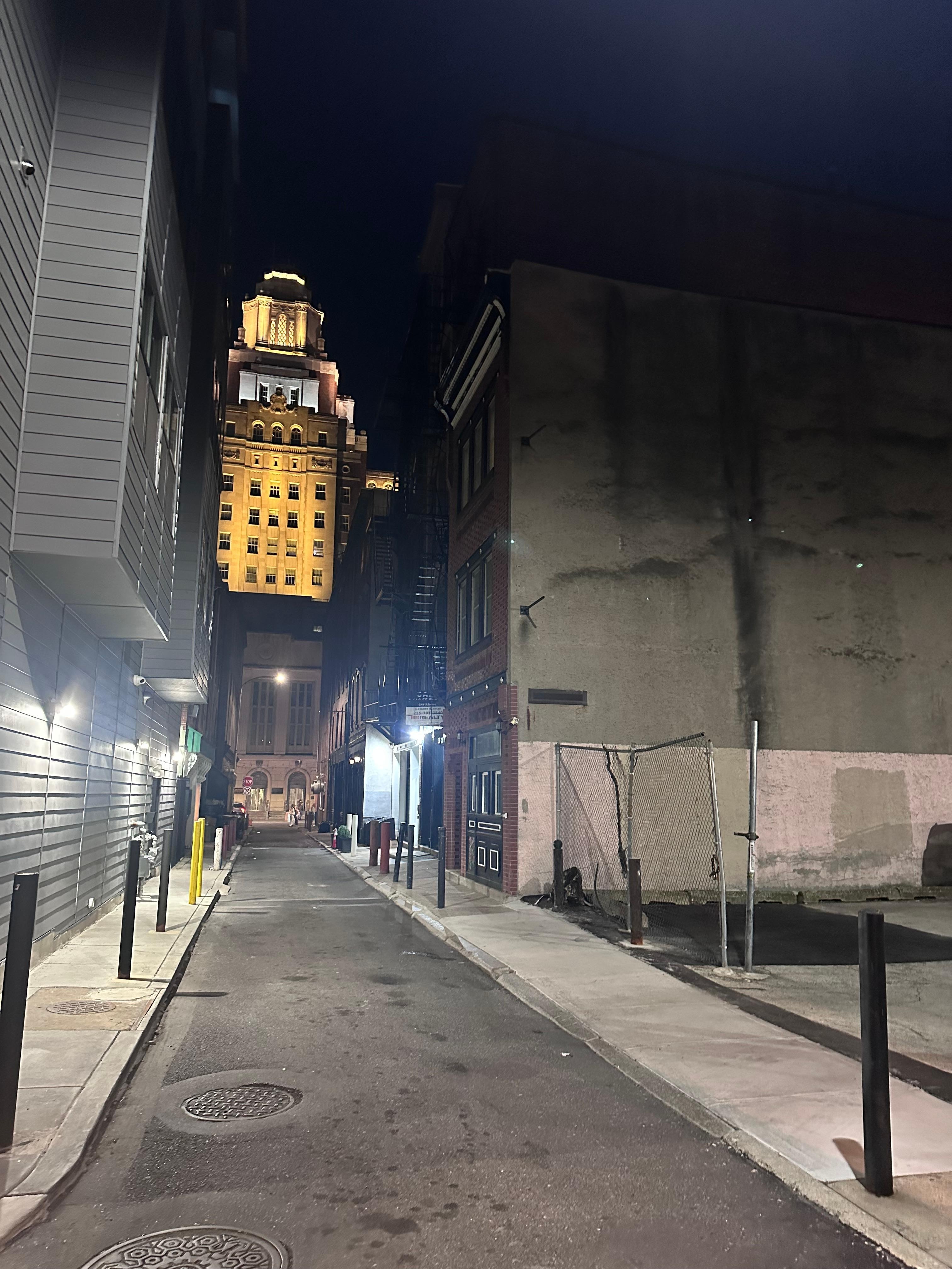 The rental is the building on right next to parking lot.  It shares an alley with restaurants and a high end apartment building which uses the lot so unfortunately you can’t park there.  But it was all well lit, clean and safe.  
