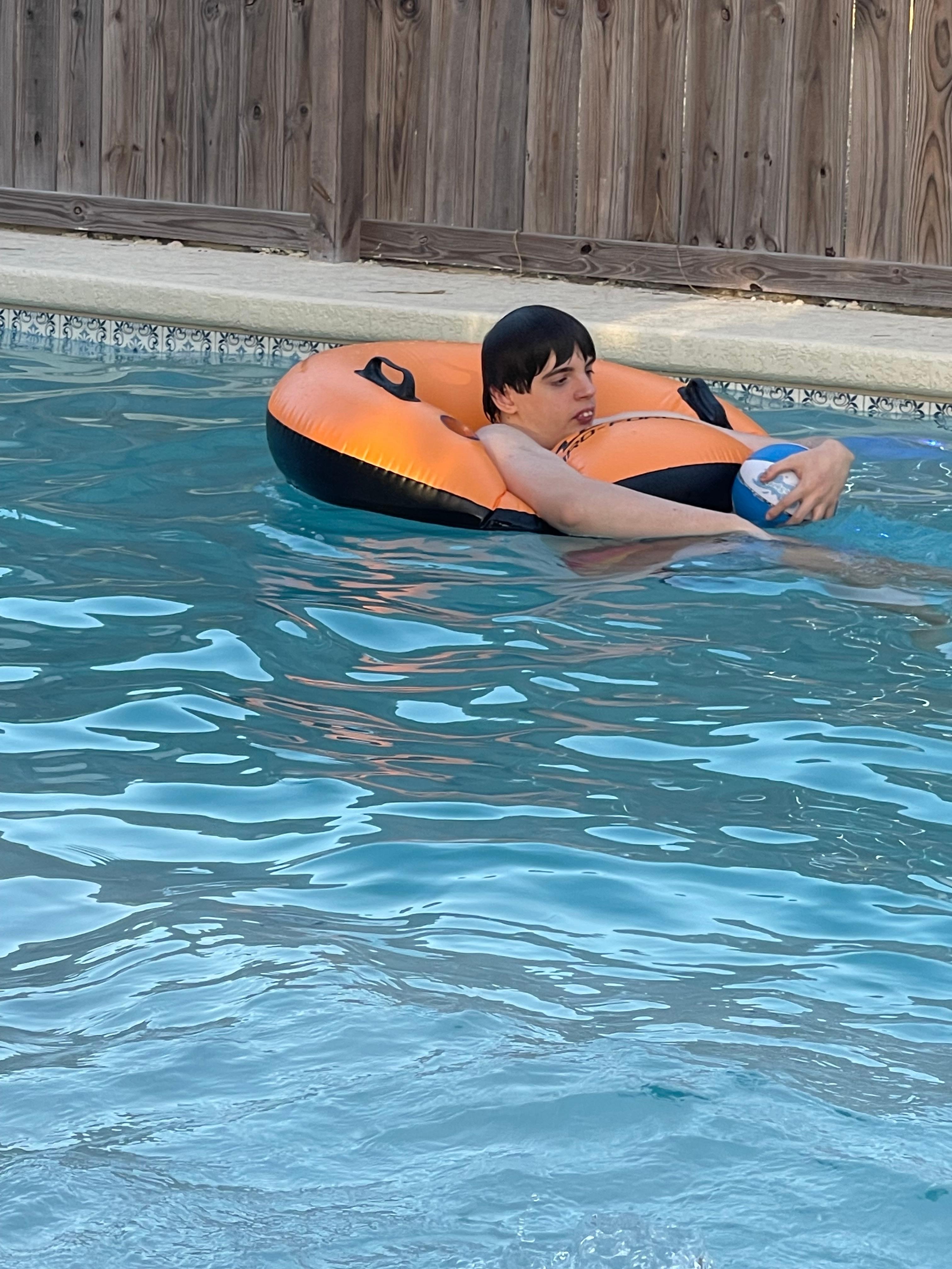 Floating in the pool.  Owners have plenty of pool and beach toys.
