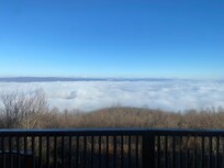 Morning view with clouds covering the lake and dam
