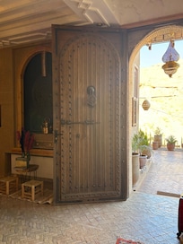 The front door is massive and gorgeous