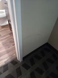 Mark or scratch on wall.