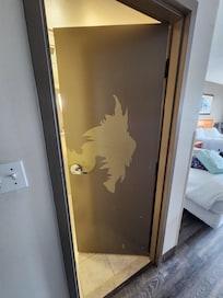 Bathroom door in one of the premium rooms.