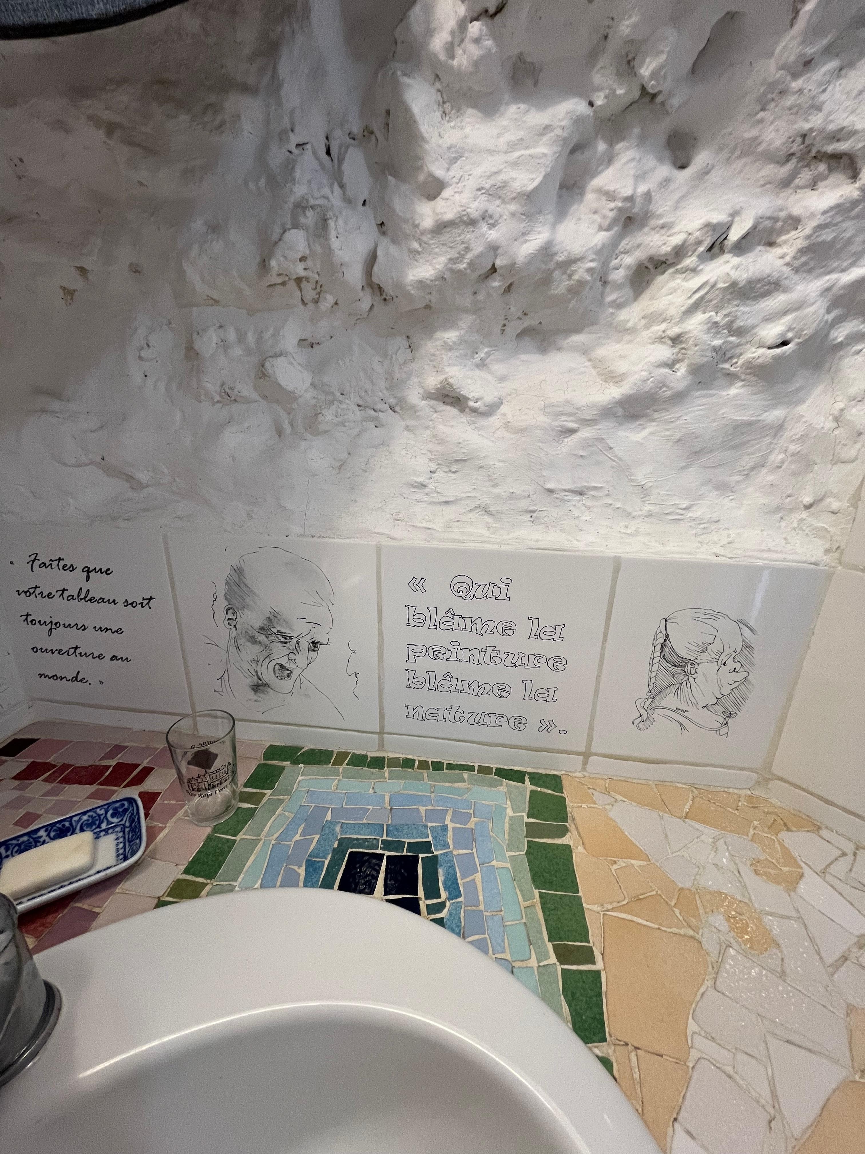 Renderings of Leonardo De Vinci art and quotes were painted on tiles the naked in a ceramic over