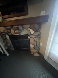 Hard to see but several rocks had fallen off the fireplace and some were even lying on the ground. Lol