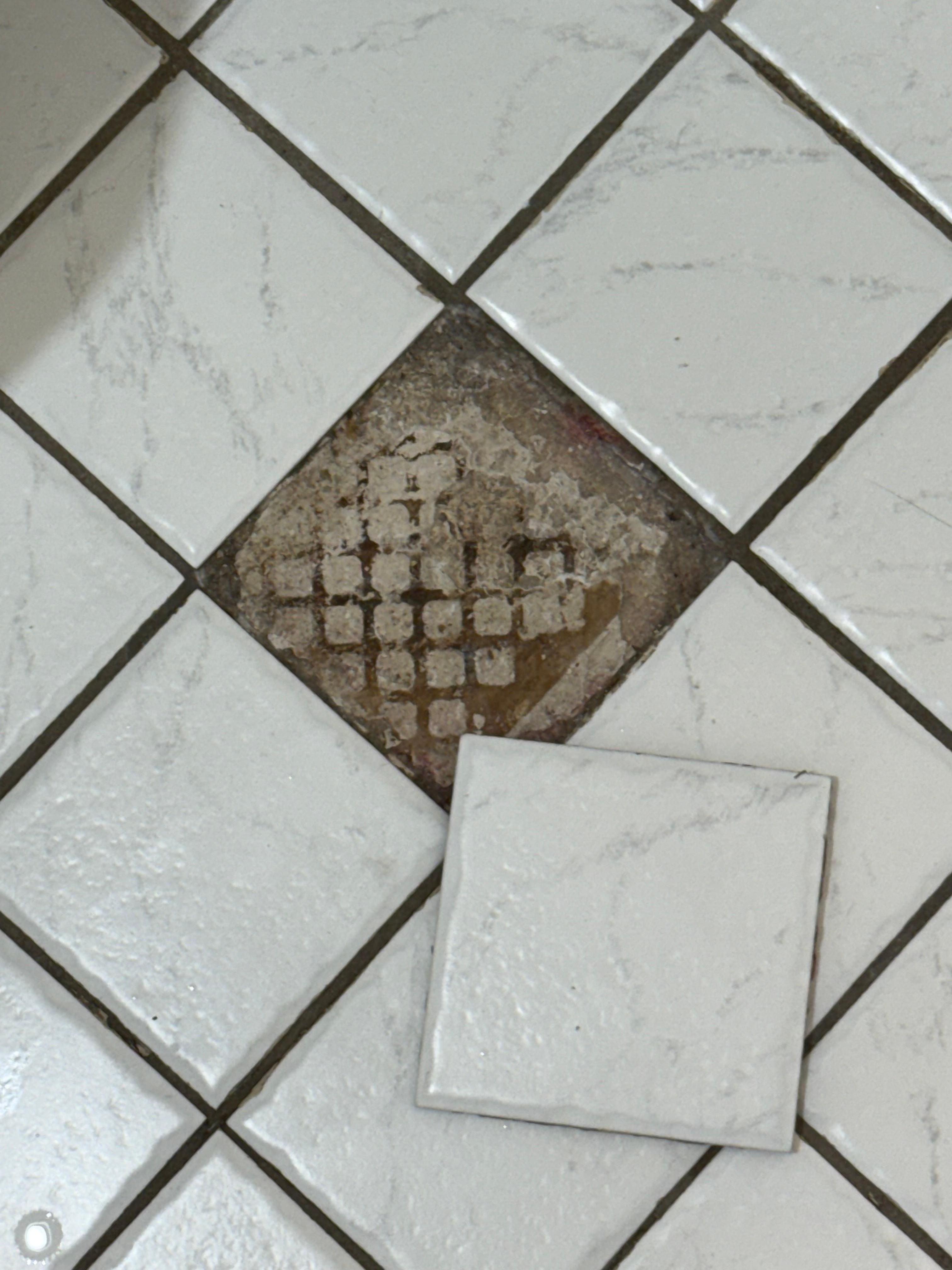 Broken tile in bathroom
