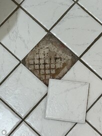 Broken tile in bathroom