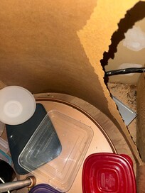 Lower right kitchen cabinet. Lazy susan broken. Lots of mouse poop.