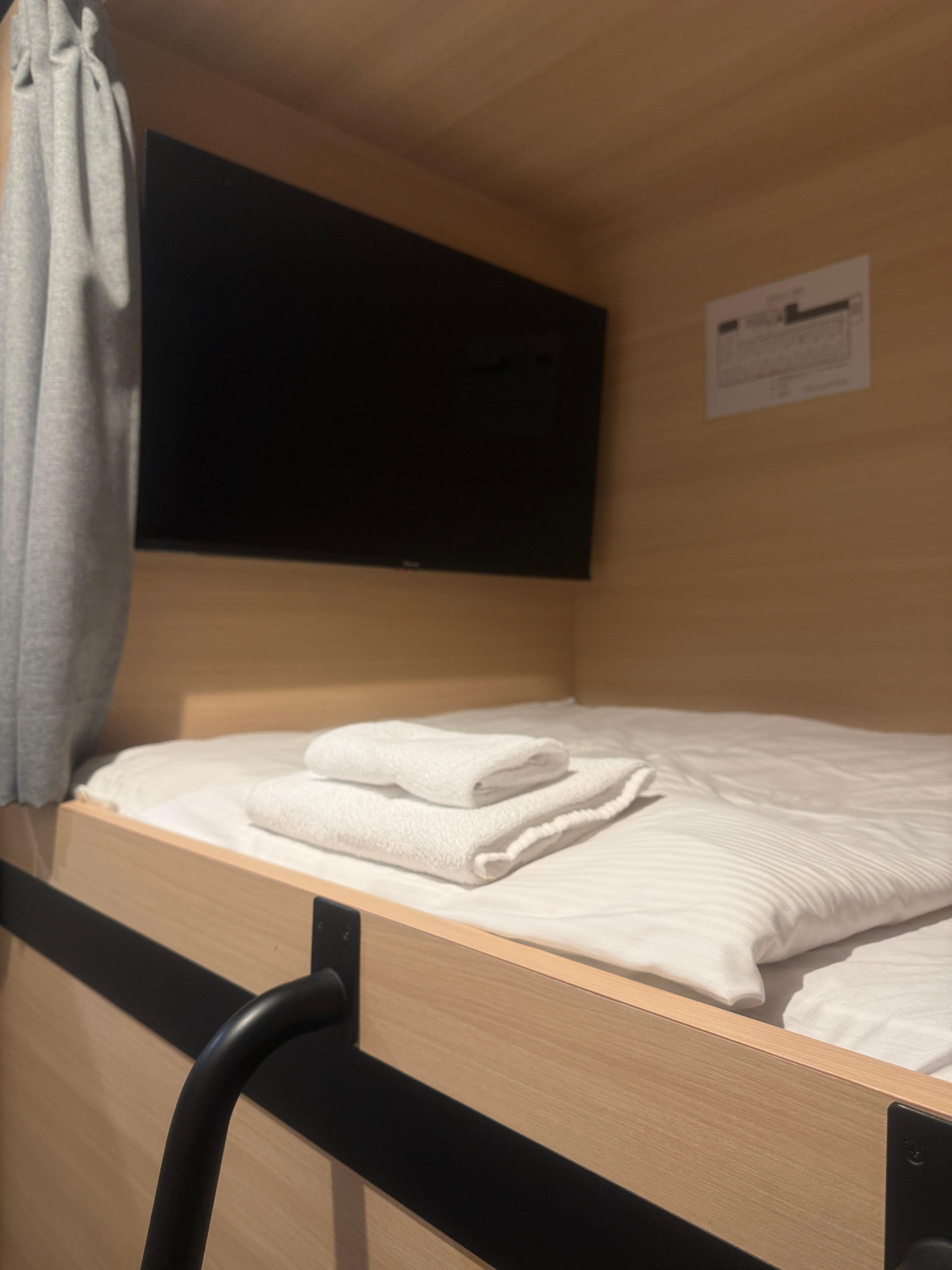 A big TV hung on the wall in the cabin. 