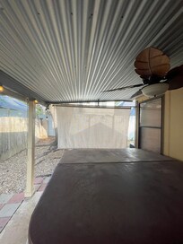 Hot tub area with broken string lights