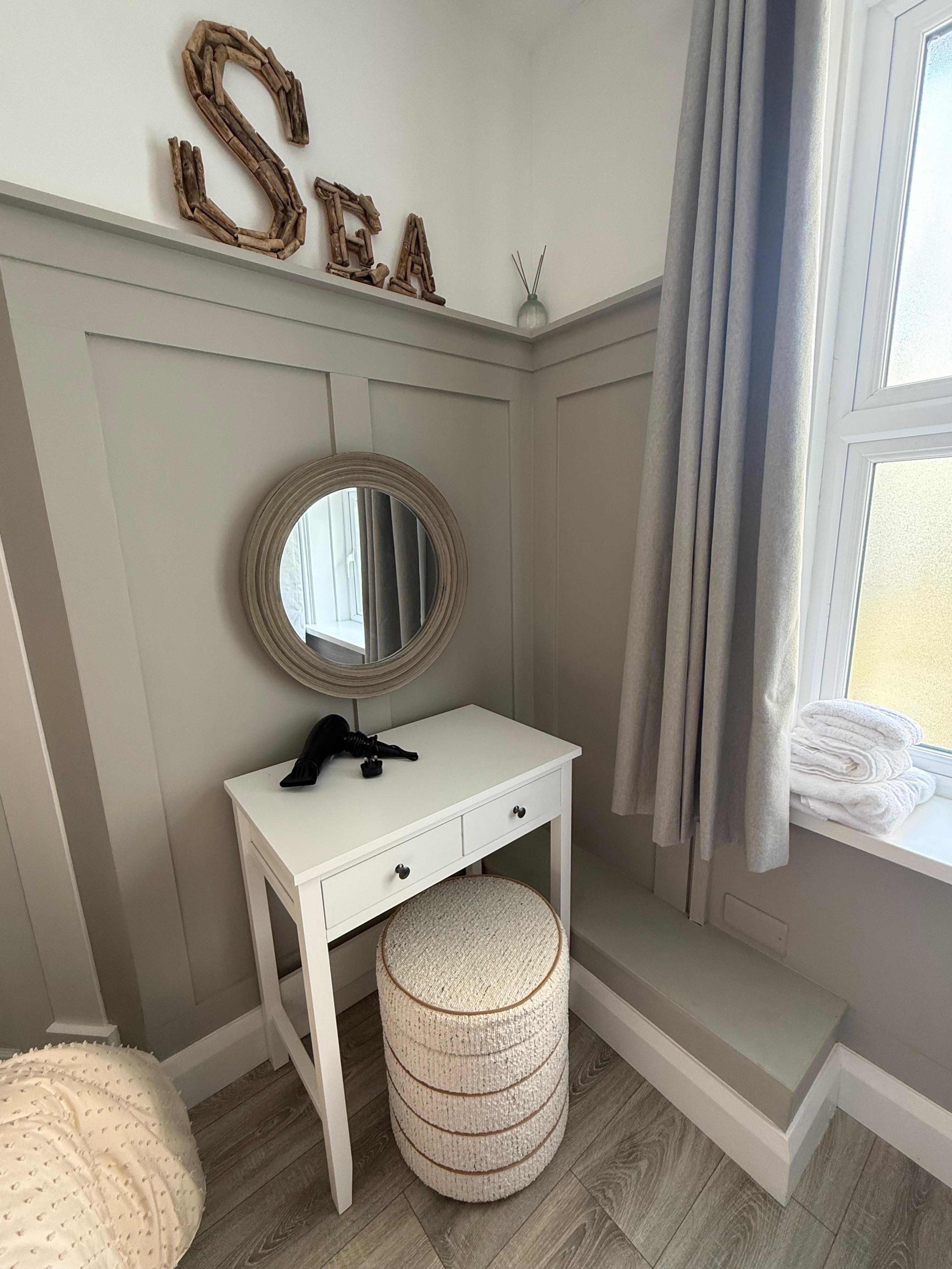 Vanity in the master bedroom to get ready.  (Could use a light shining on the face to put on makeup.) 