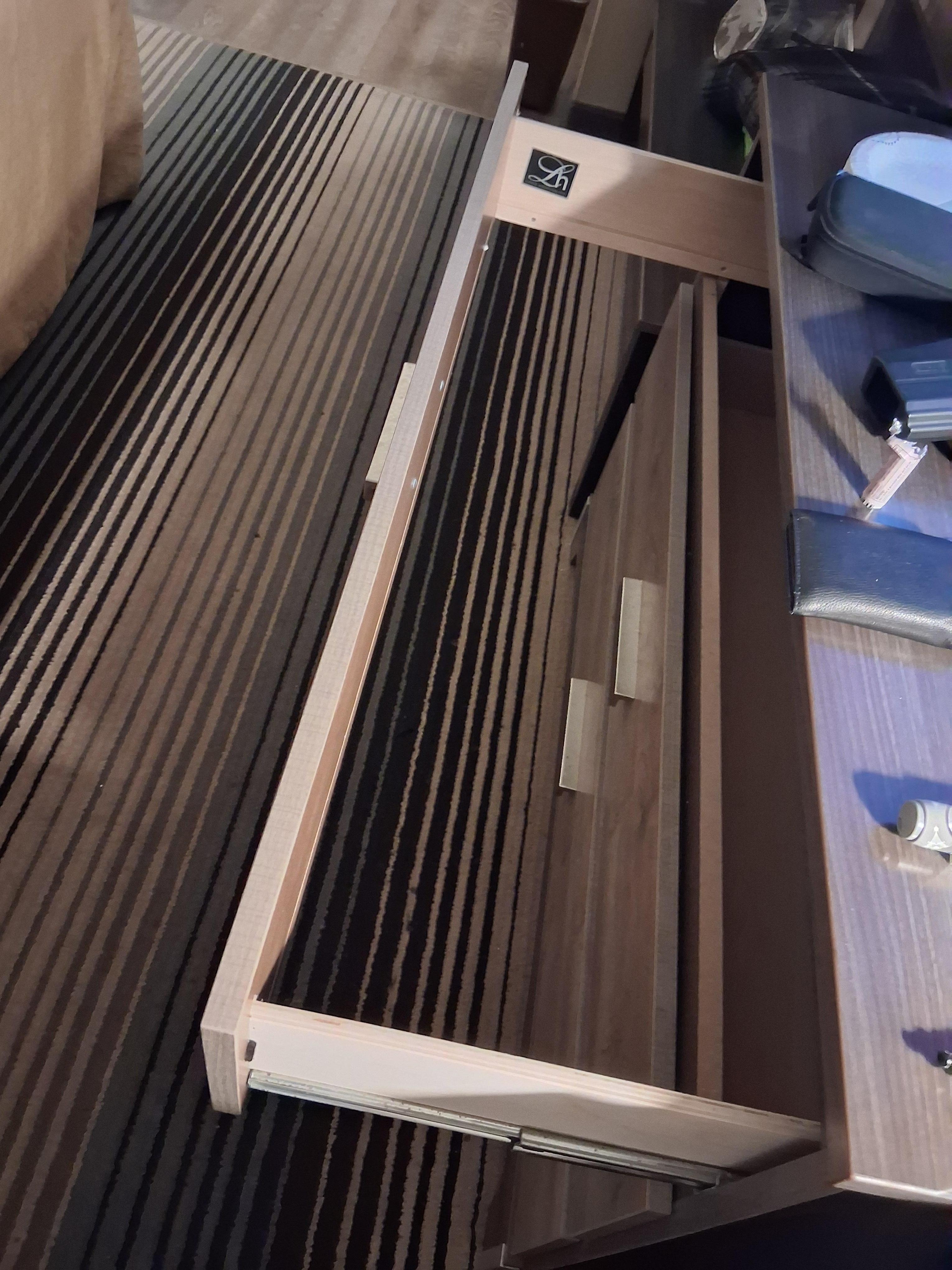 Top drawer, missing panel.