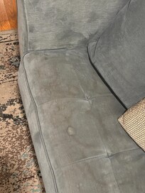 Stained couch beyond comfort.