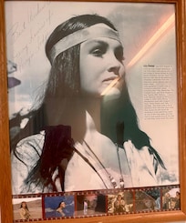 Autographed portrait in room.