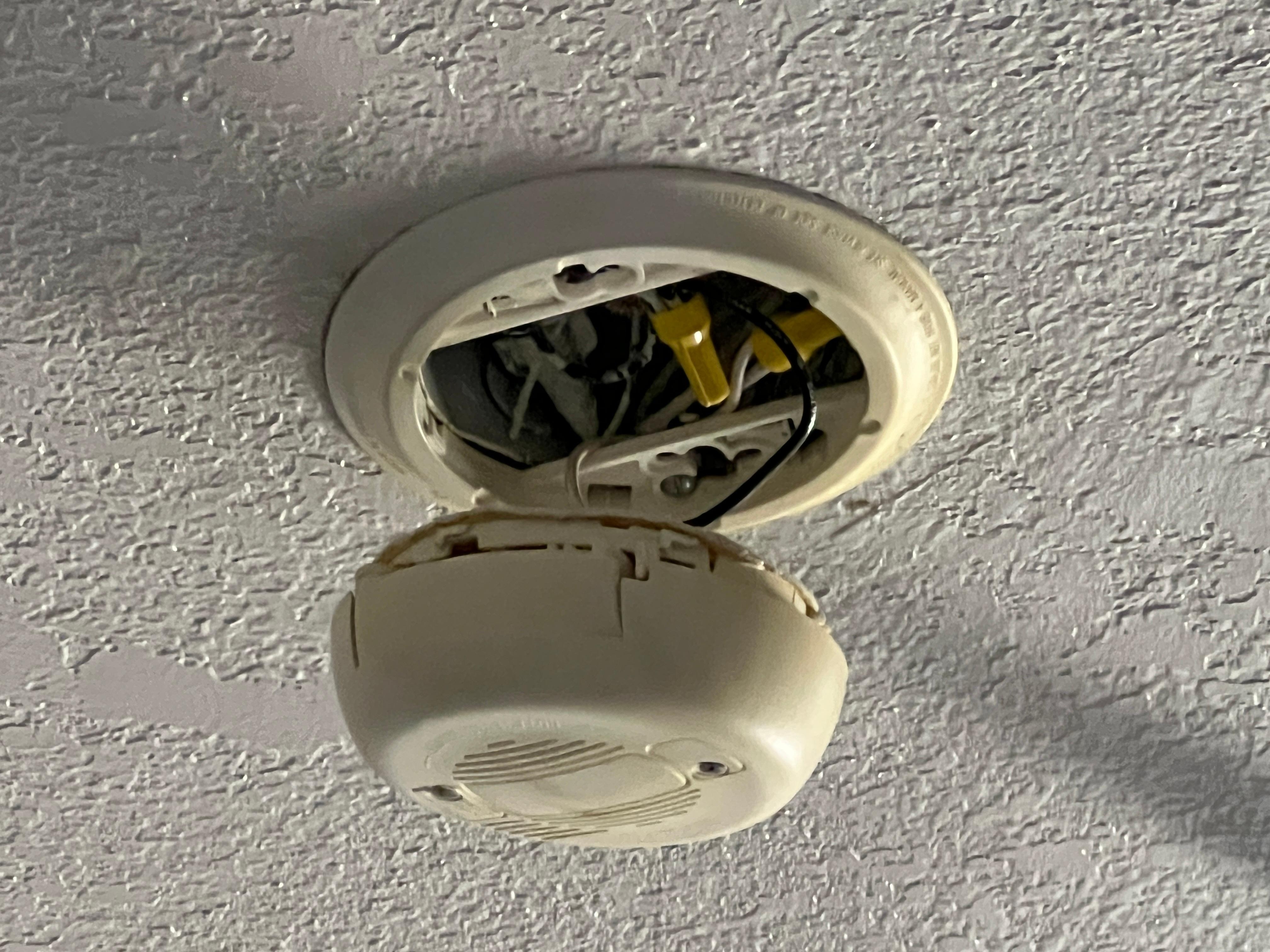 Smoke detector hanging from the ceiling 