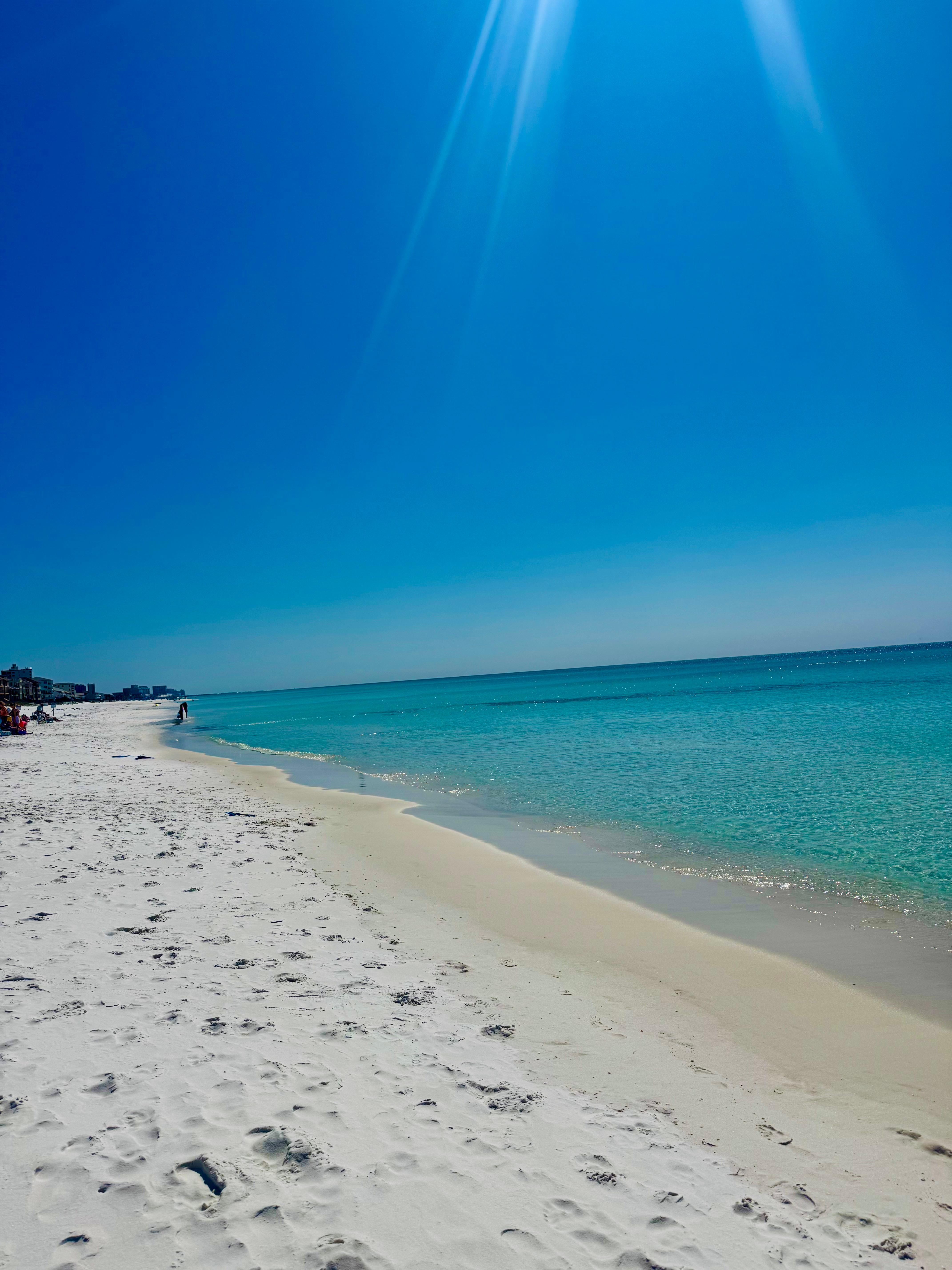 Beach access white sand and clear blue water