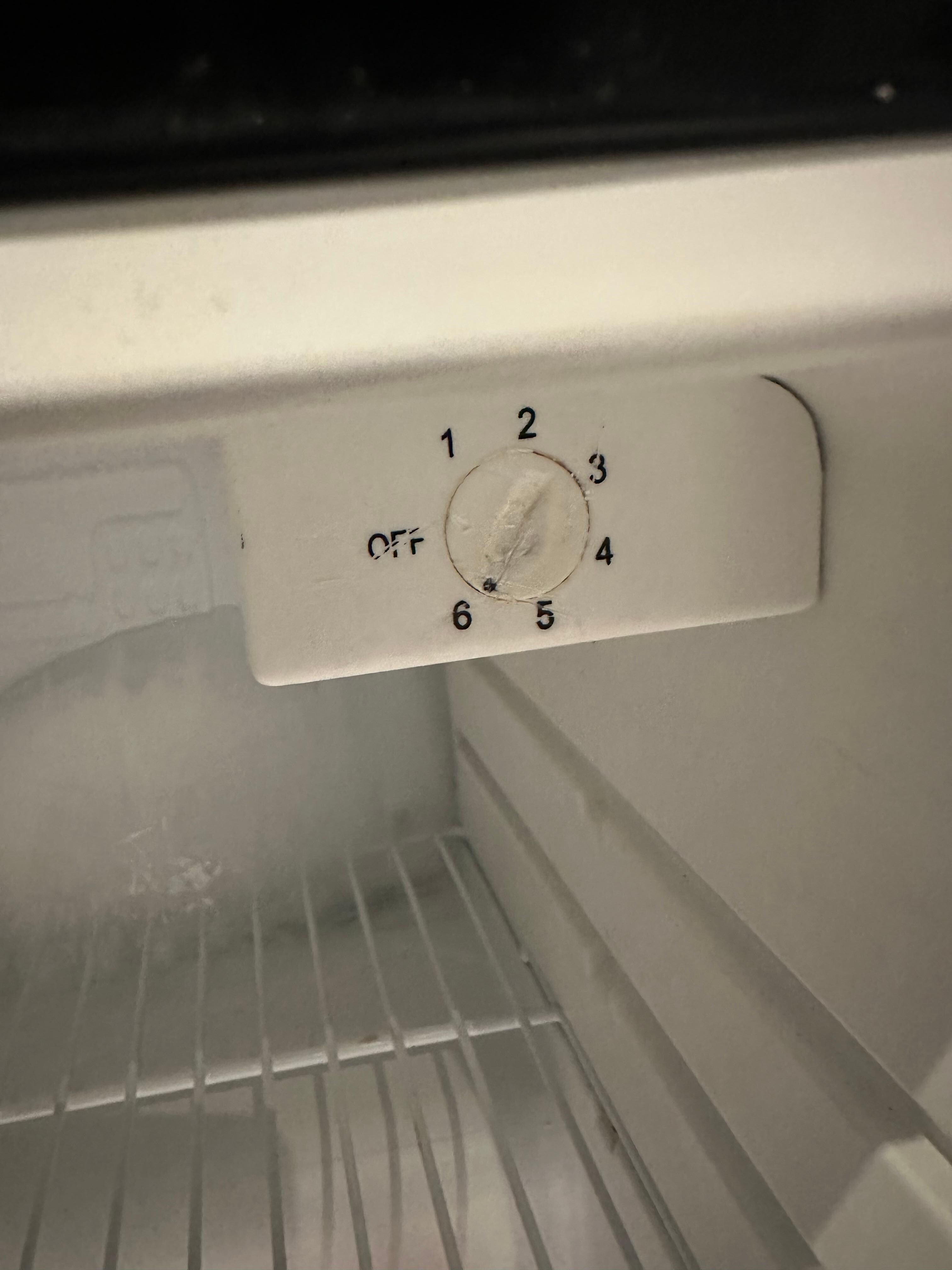 Broken fridge in room
