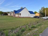 Outside with front and side yard!