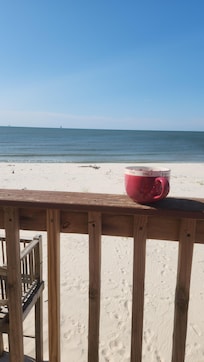 Back deck and my cup coffee