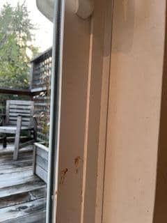 Sticky mess below handle of sliding glass door