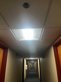 The hall smelled like marijuana. Here is a light fixture missing the covering part.