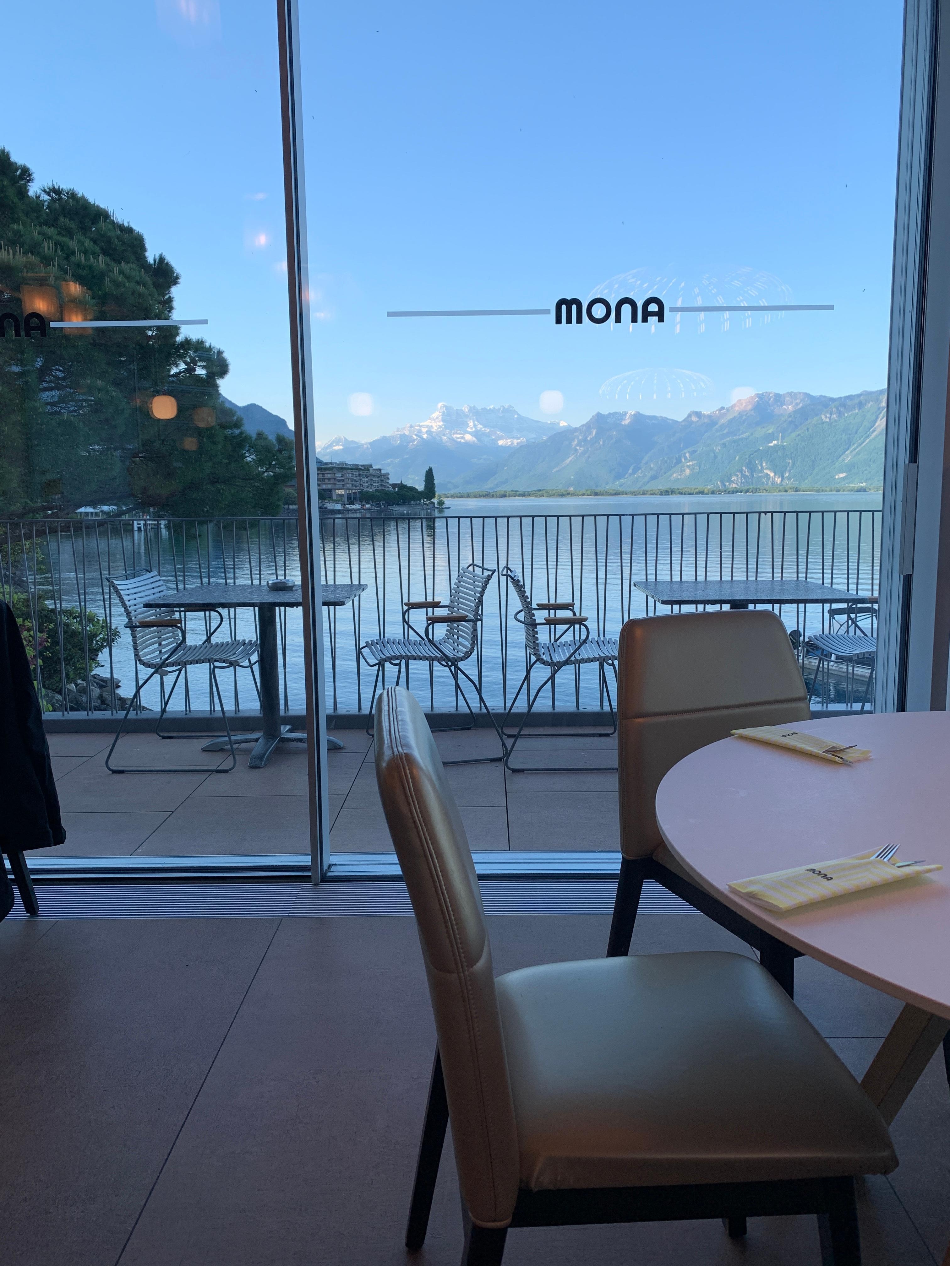 Breakfast room with full view windows of the lake