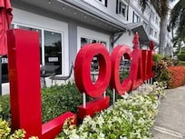 Front side of the hotel near the ice cream shop!