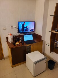 My setup to get internet. Mini fridge does not fit in cabinet, I used it as a bench to sit and get my work done.