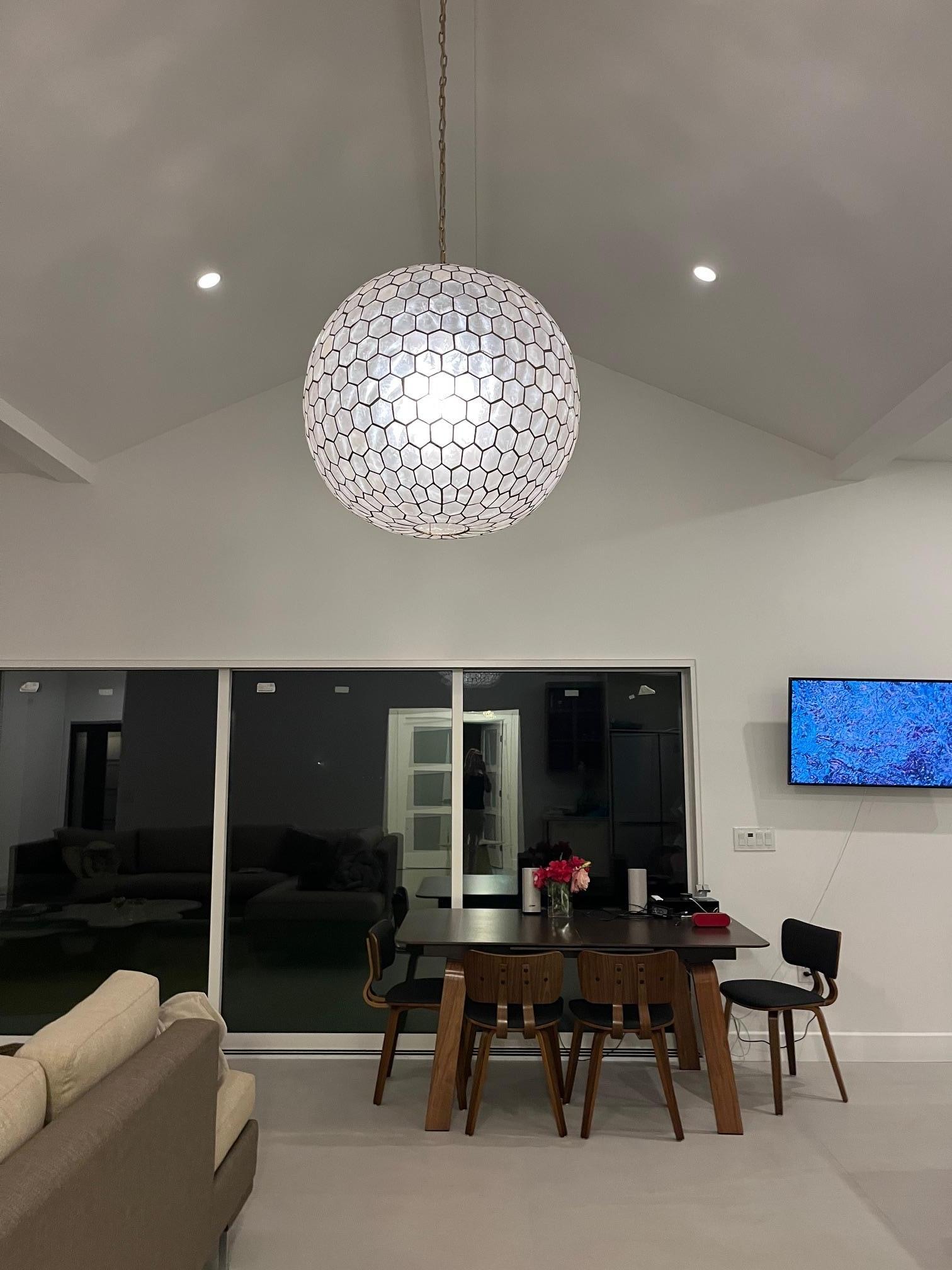 High ceilings in the main room with a jaw-dropping canyon view in the day through large patio doors, opened on to a deck