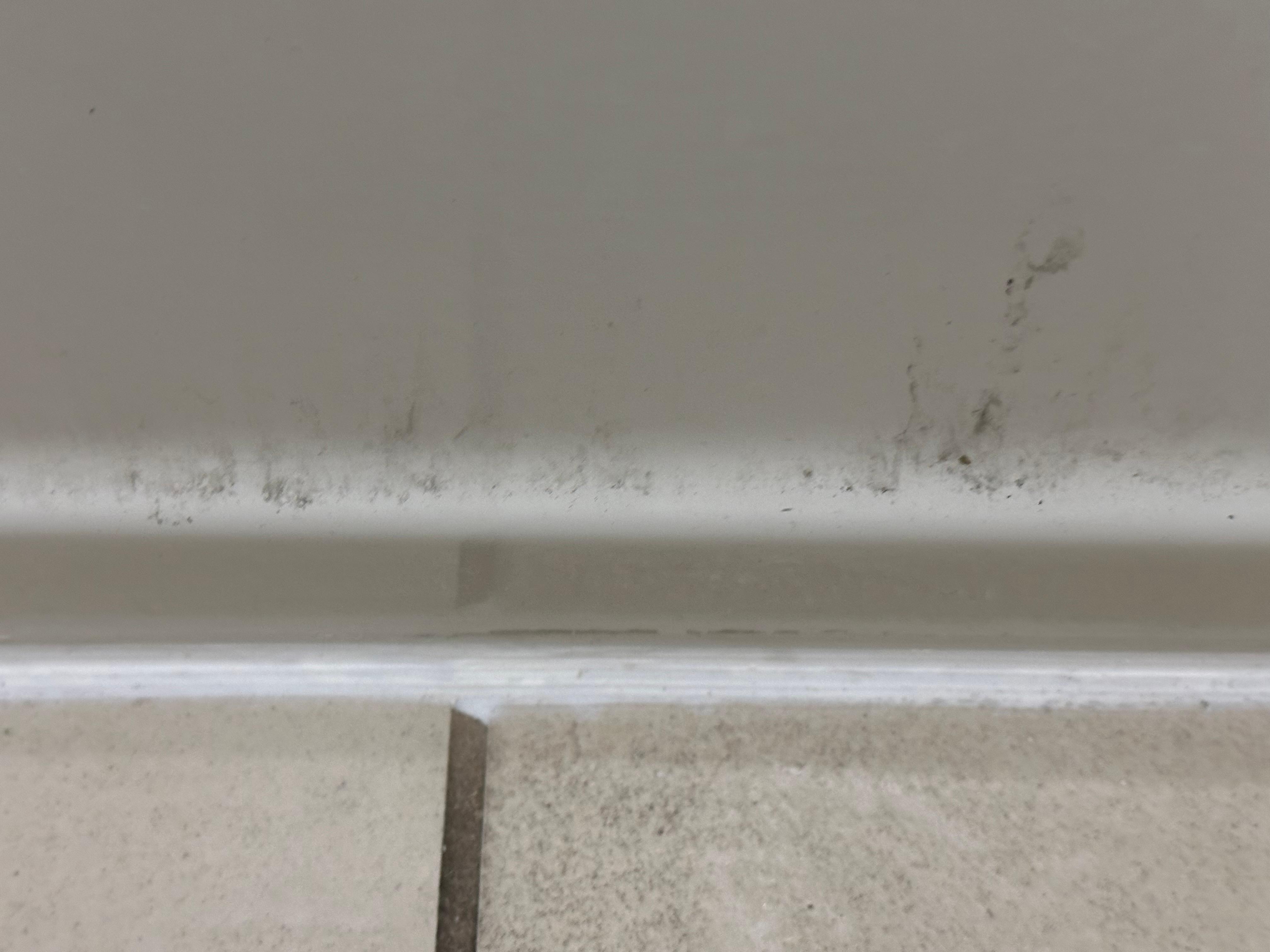 Around the base of the tub