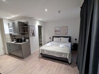 The bedroom and kitchenette