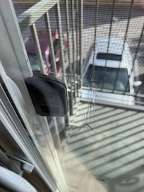 Holey screen door to balcony