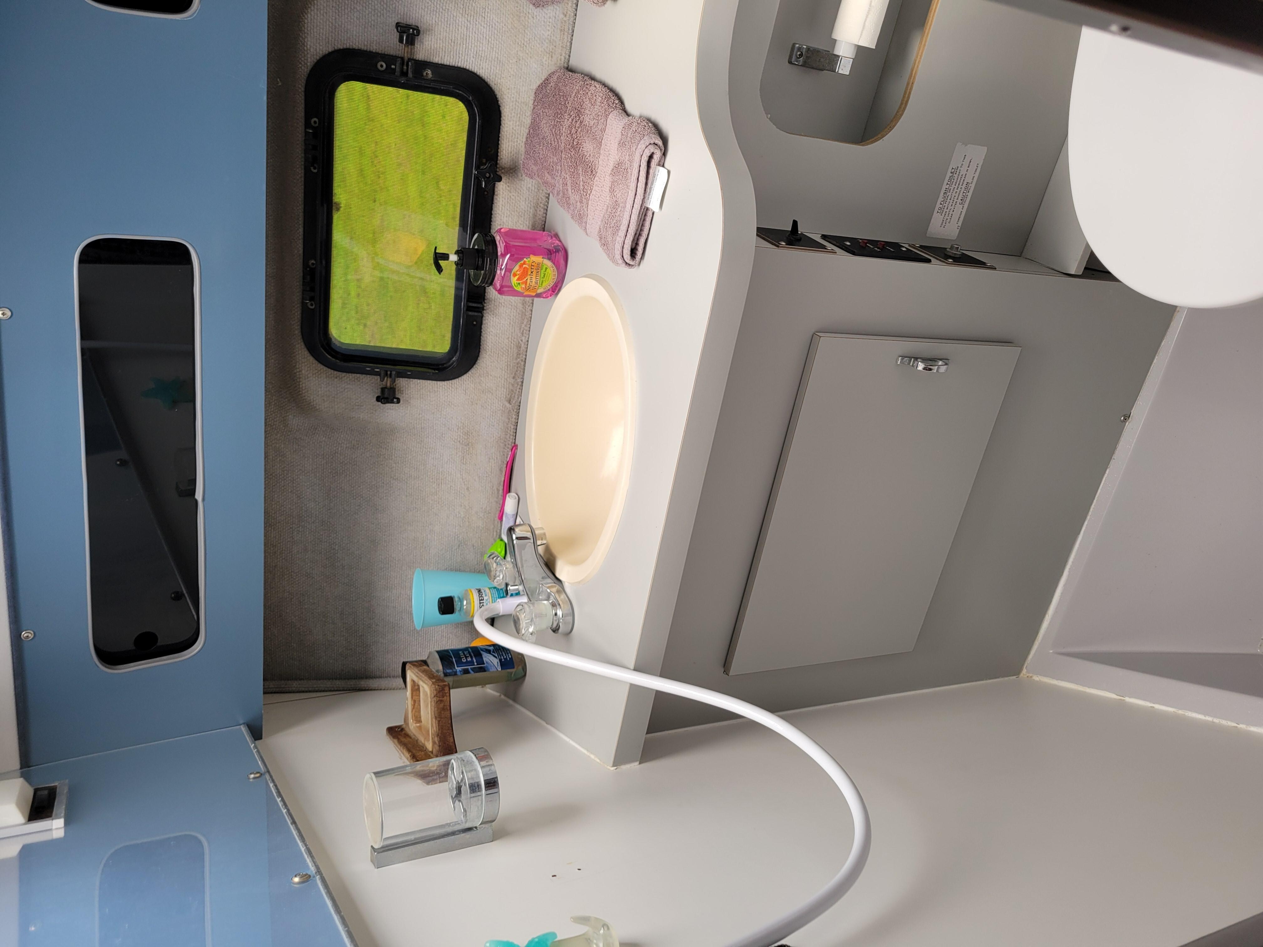 The shower is connected to the sink, very easy to use and when you pull the curtains around, everything stays dry!  Yes you shower with the toilet, haha!!