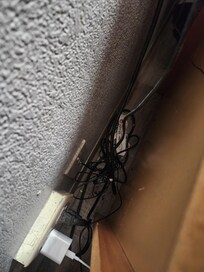Trash beside dresser