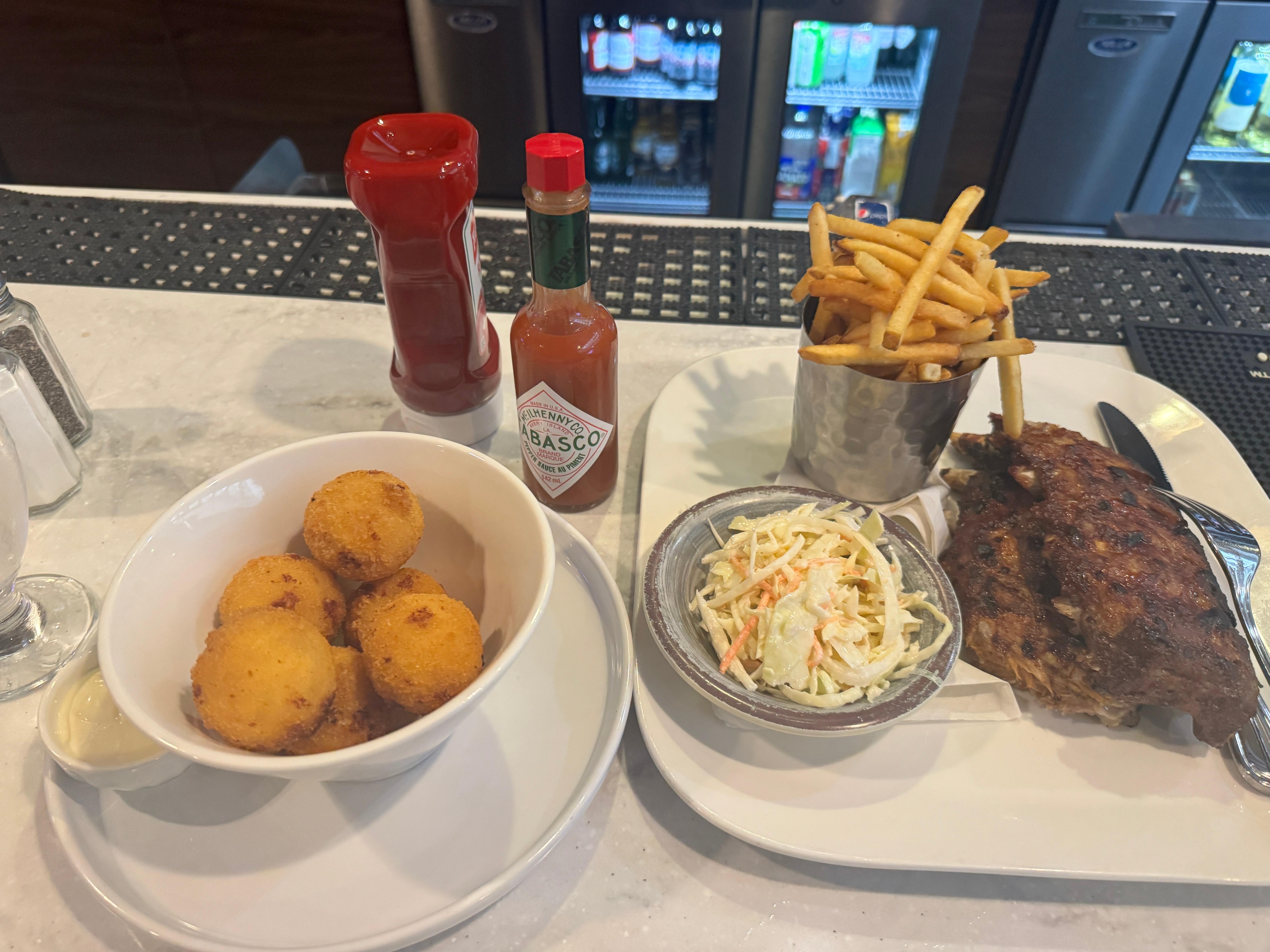 Cheese balls , pork ribs and coleslaw 