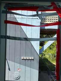 door to the pool area with screen duck taped and still falling apart