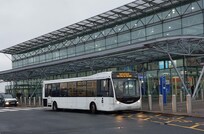 Exterior shot of the airport and internal bus service/courtesy coach for long-stay carpark. Only 3°C and wet.
