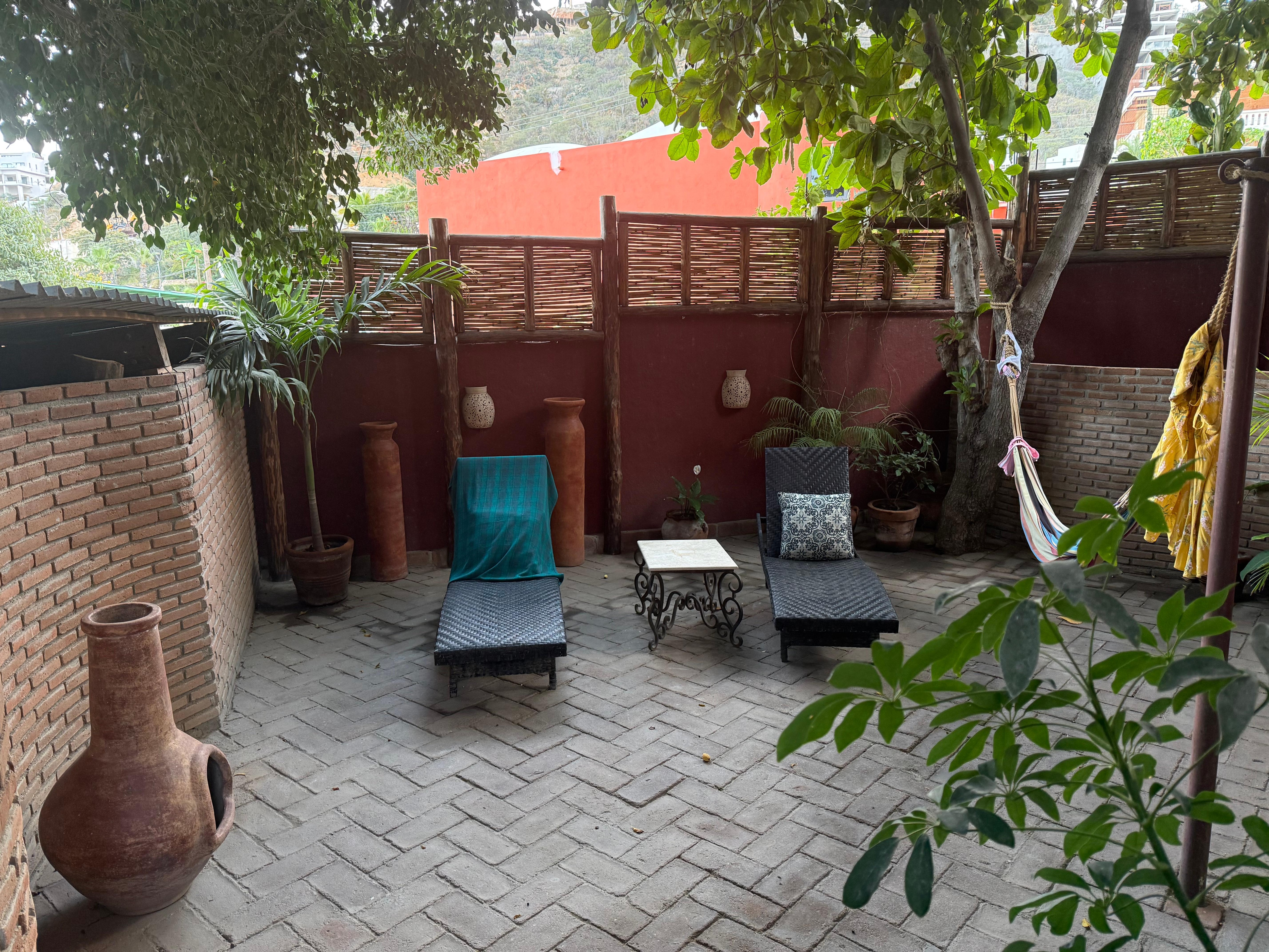 Our Private patio with hammock and lounge chairs.