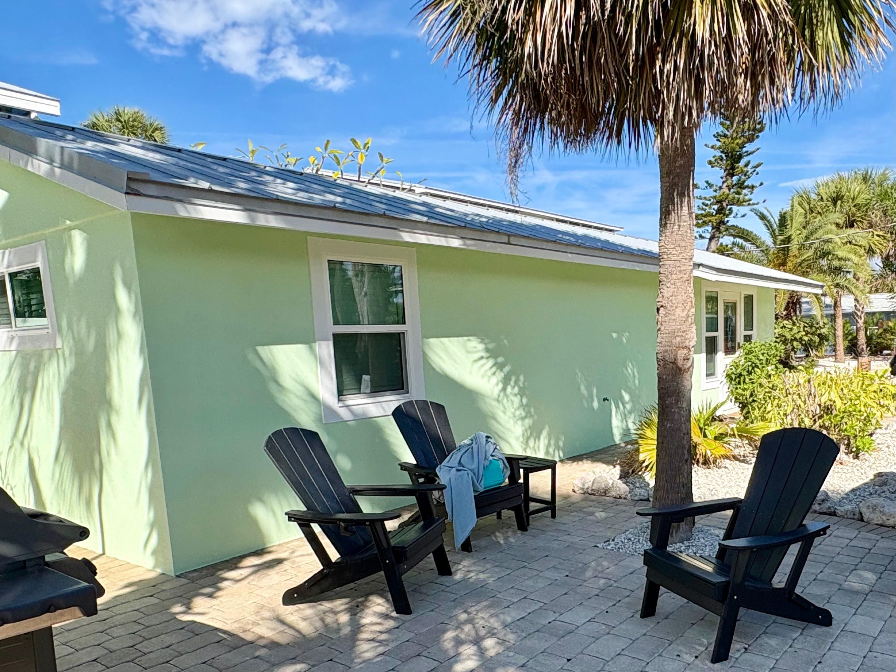 One of the outside sitting areas with a gas grill. 
